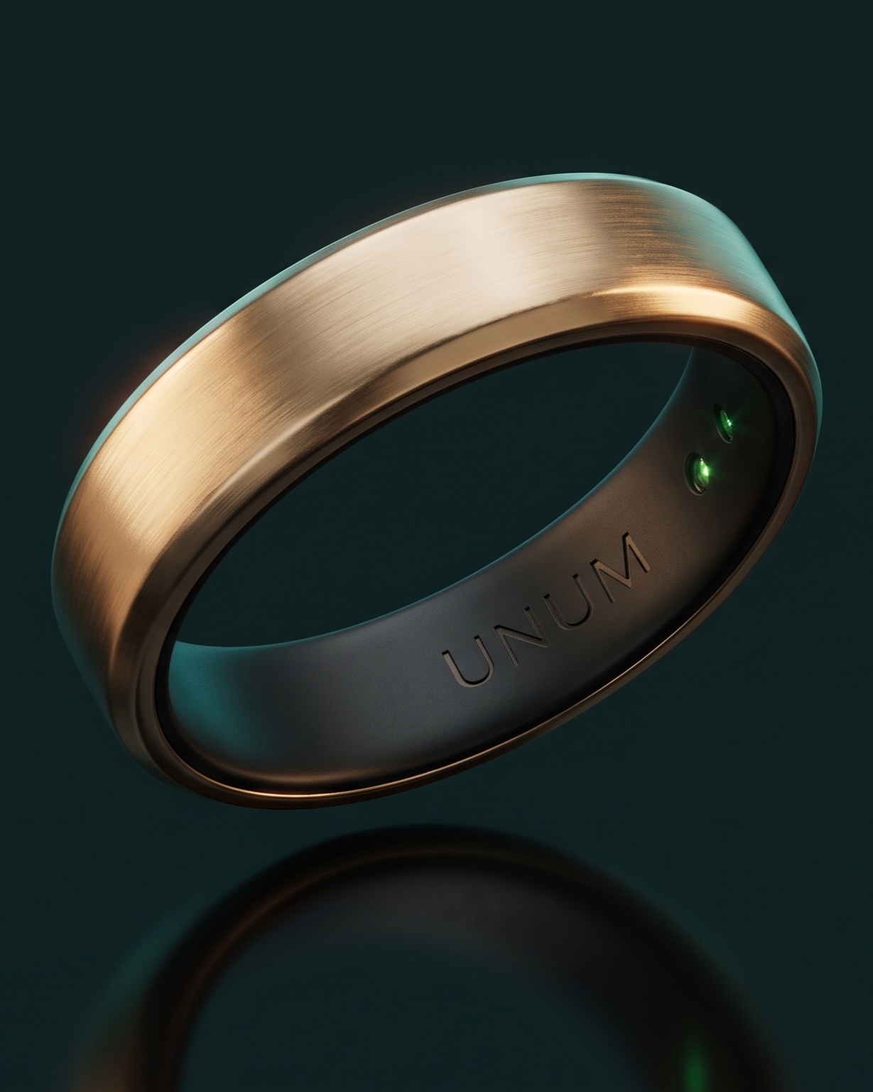 The Unum ring: a slim brushed champagne-gold band with a dark interior engraved UNUM